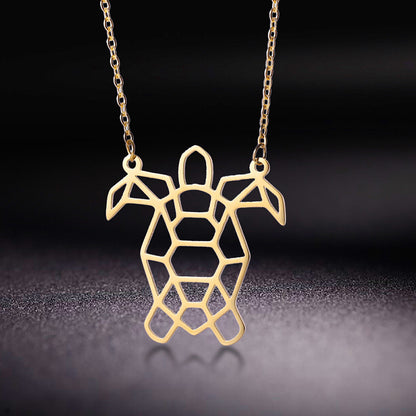 Cute turtle pendant on an illuminated  black background  