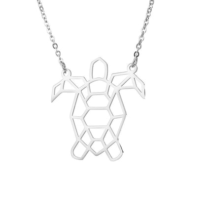 A silver turtle necklace on a white background 